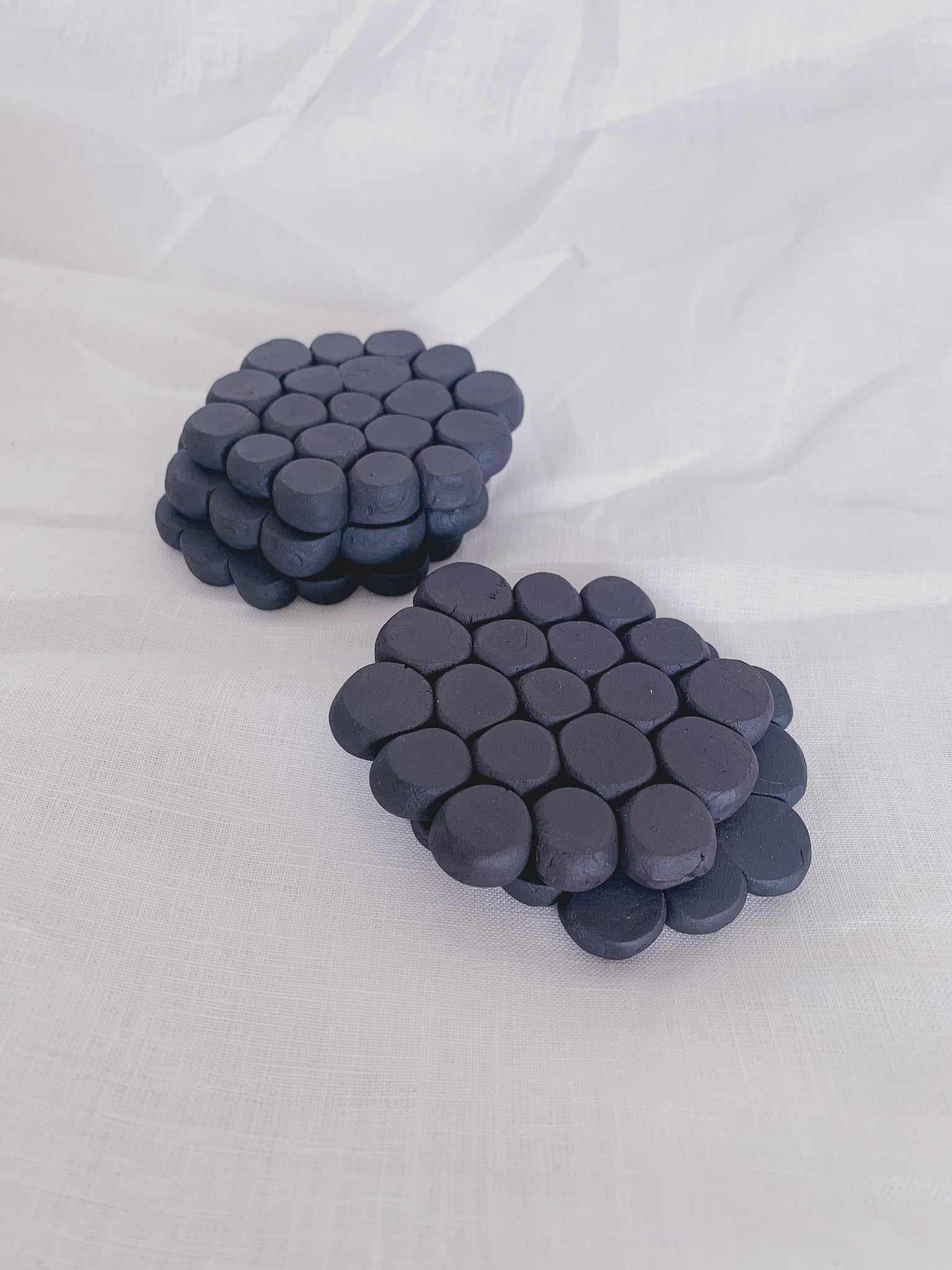 black pebbles coasters